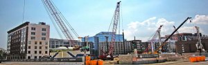 performance bonding - The image shows a construction site with a tower cranes.