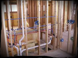 Picture of plumbing - The image shows a plumbing set up inside a constructed house.