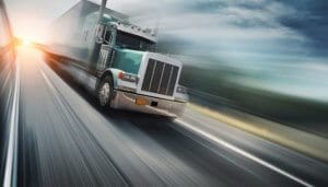 Fuel tax bonding - The image shows a wheeler truck speeding.