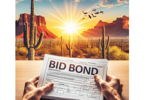 Hands holding a bid bond form with a bright Arizona desert landscape in the background, featuring cacti and mountains at sunrise, emphasizing the importance of bid bonds in Arizona's construction industry.