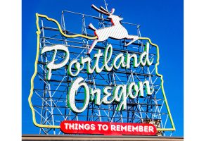 Iconic Portland, Oregon neon sign with a reindeer atop, emphasizing key things to remember about securing bid bonds in the state.