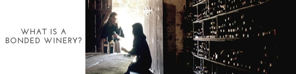 What is a bonded winery? This image shows two women holding and drinking a glass of wine in a Wine cellar.