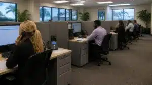 Customer service team at a Florida commercial collection agency processing commercial collections and maintaining accurate debt recovery records.