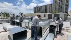 Florida commercial sheet metal workers installing custom HVAC ductwork on rooftop