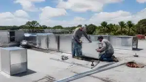 Florida sheet metal contractor installing rooftop ventilation ductwork for commercial HVAC system