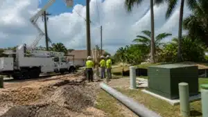 Florida utility infrastructure crew performing utility connection permit work with power line and underground service installation