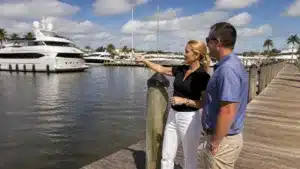 Florida yacht broker reviewing yacht sales contract and purchase documents with a client