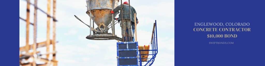 Englewood, CO – Concrete Contractor $10,000 Bond - Concreting work. Construction site workers pouring concrete into formwork at building area with skip.