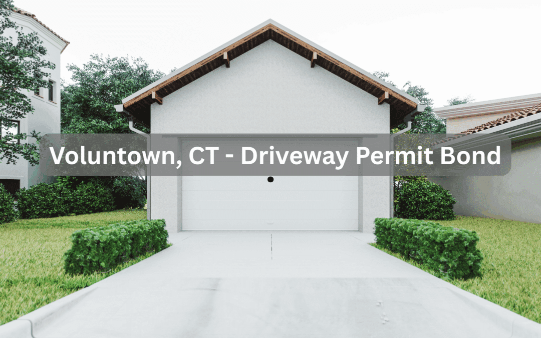 A clean, straight driveway leading to a closed garage in a suburban Voluntown, CT neighborhood.