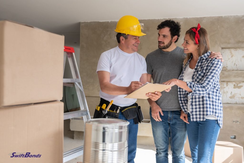 While renovating their home, a contractor converses with a couple. idea for home renovation.
