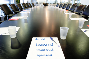 Conference room with a focus on Nebraska license and permit bond agreements, essential for business compliance.