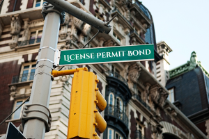 New York street sign indicating 'License Permit Bond' – highlighting the importance of license and permit bonds in ensuring legal compliance for businesses in New York.