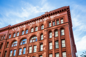 Historic building with 'License and Permit Bond' written across, symbolizing the importance of obtaining bonds in Oregon for business compliance.