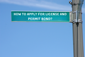 Green road sign reading ‘How to Apply for License and Permit Bond?’ against a blue sky, representing the bond application process in Pennsylvania.