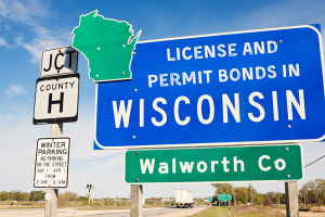 Road sign reading 'License and Permit Bonds in Wisconsin' near Walworth County, symbolizing the regulatory importance of bonds in the state.