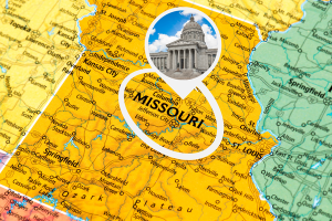 Map of Missouri highlighting key cities with an image of the Missouri State Capitol, symbolizing legal regulations and requirements for license and permit bonds.