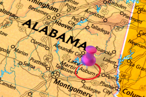 Map highlighting Auburn, Alabama with a red pin marker, showcasing the city's location relative to Montgomery and nearby regions.