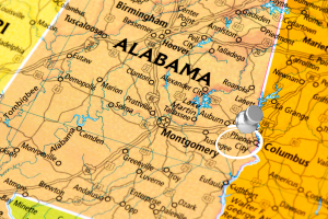 Close-up map of Alabama highlighting Phenix City with a pin, showing its location near Montgomery and Columbus, ideal for performance bonds and construction projects in the region.