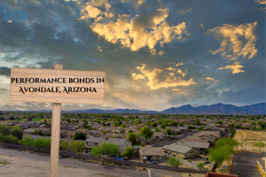 Panoramic view of Avondale, Arizona, showcasing a suburban neighborhood under a vibrant sunset sky with a wooden sign labeled 'Performance Bonds in Avondale, Arizona.' This image captures the city's growing infrastructure and highlights the importance of bonds in supporting local development.