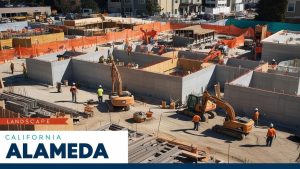 A bustling construction site in Alameda, California, showcasing workers, cranes, and heavy machinery building modern infrastructure—highlighting the importance of performance and payment bonds in ensuring project completion.