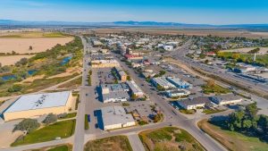 Panoramic view of downtown Tulare, California, highlighting key landmarks, modern developments, and scenic landscapes.