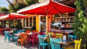 A vibrant outdoor cafe with colorful chairs and umbrellas in Yucaipa, California, showcasing the city's lively dining culture and community charm.