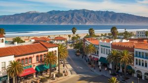 Downtown Santa Barbara with palm-lined streets, red-roofed buildings, and ocean view in the background. This image reflects the city’s unique charm, where construction projects may be supported by performance bonds to ensure quality and compliance.