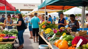 Visitors shopping at a lively farmers market in Deltona, Florida, with colorful fresh produce, flowers, and local vendors under bright tents.