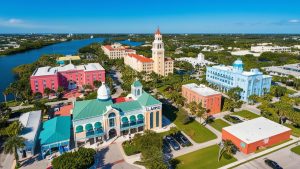 Aerial view of downtown Largo, Florida, featuring colorful historic buildings, palm trees, and a scenic waterway, reflecting the city’s charm and community-oriented design.