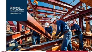 Construction workers assembling a steel structure at a job site in Cambridge, Massachusetts, showcasing teamwork and progress in commercial development.