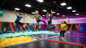 Children enjoying a vibrant trampoline park in West Des Moines, Iowa, showcasing an exciting indoor recreational activity for families and kids.