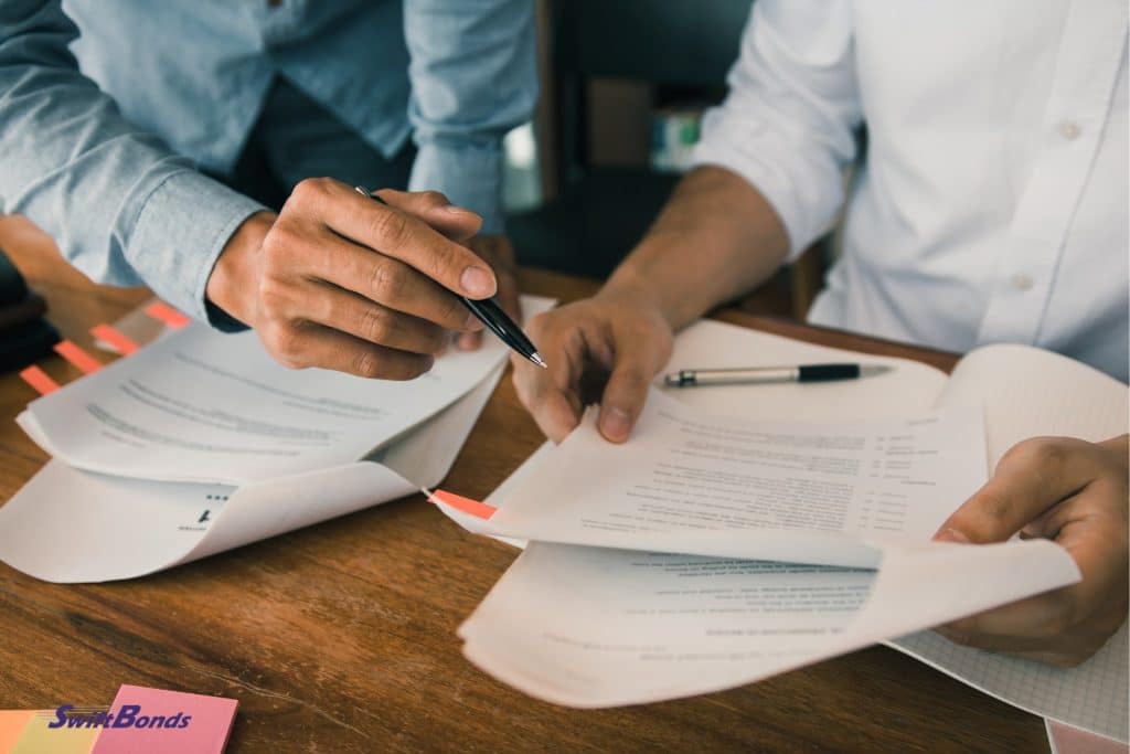 A woman and a man discussing the company's performance review.