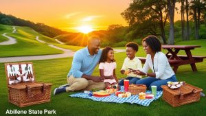 Family enjoying a picnic at Abilene State Park in Abilene, Texas during a sunset, showcasing local outdoor recreation and community lifestyle. 