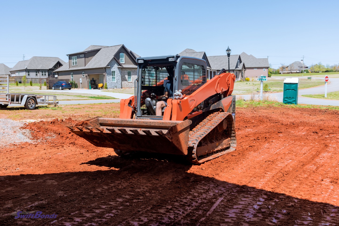A bulldozer is used to move earth while gardening and improving the area.