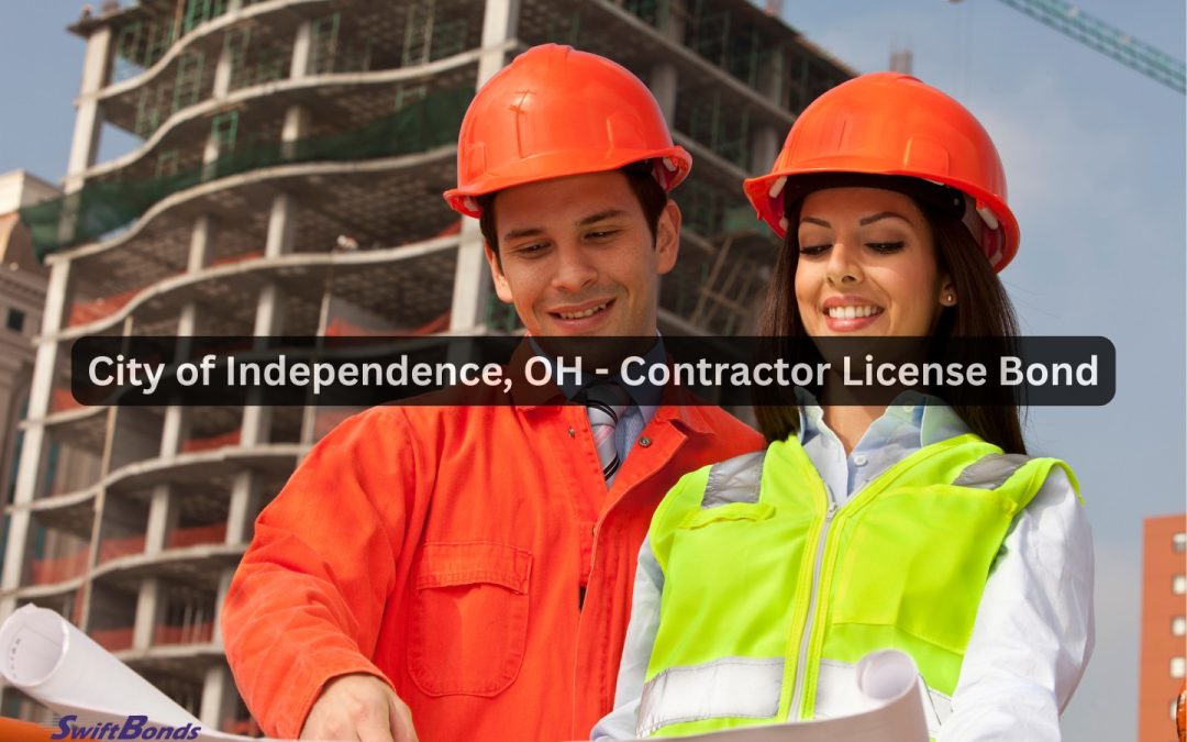 At a construction site, a building contractor talks about the designs.