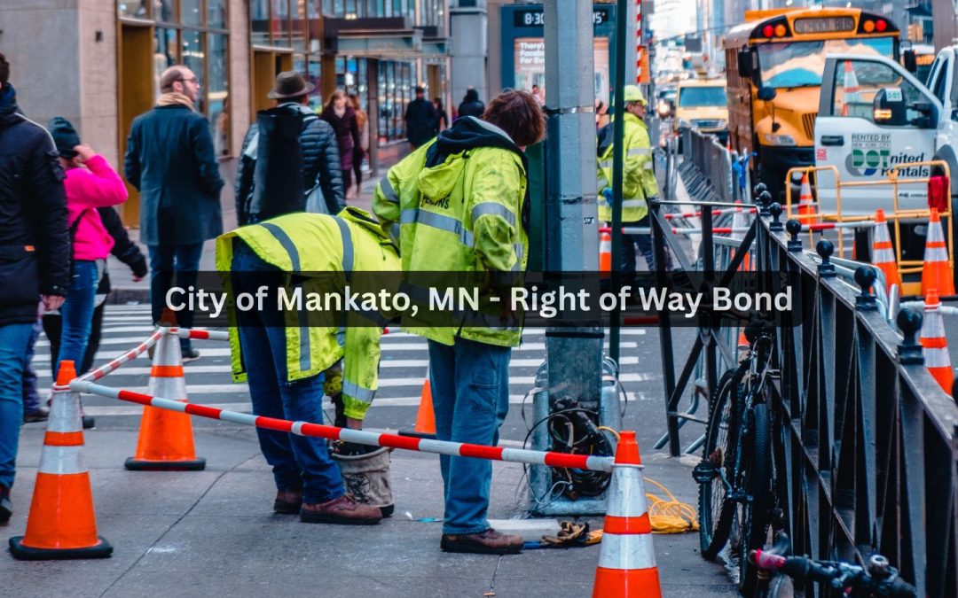 While a worker placed a barrier, people were walking on the sidewalk.