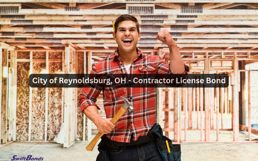 A happy construction worker with a hammer inside the finished home.