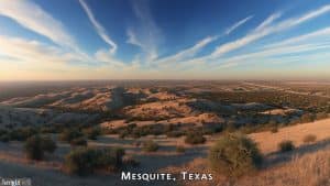 Aerial view of desert hills and sprawling neighborhoods in Mesquite, Texas with vivid sunset lighting and dramatic cloudscape.