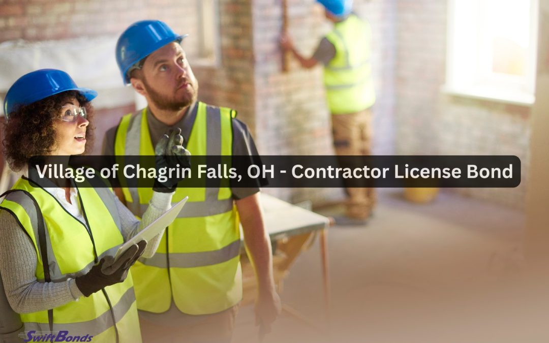 Standing inside a remodeling project, a contractor holds a tablet and engages in conversation.