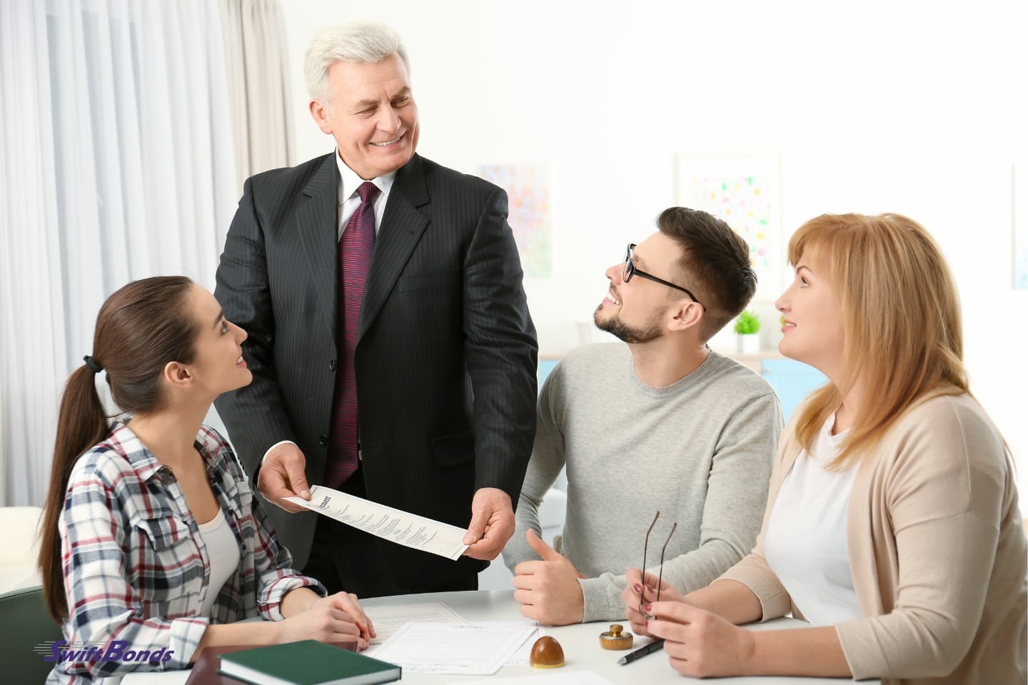 At the office, a notary public consults with the family.