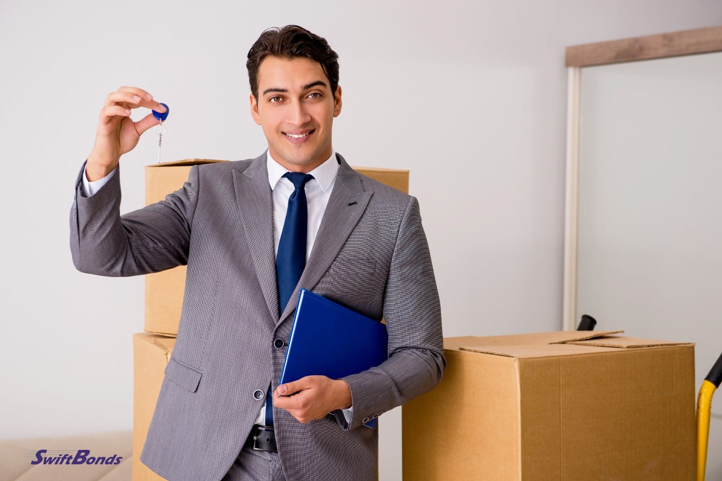 Real estate agent holding the new home's key.