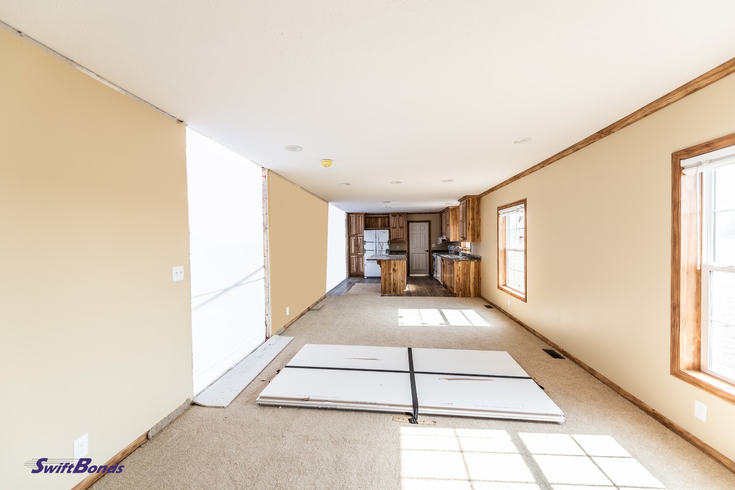A manufactured home's inside half upon arrival at its permanent site.