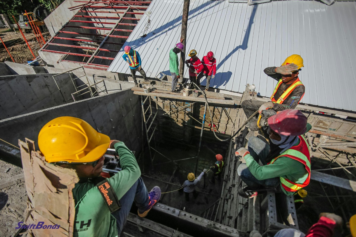 Men working on construction site.