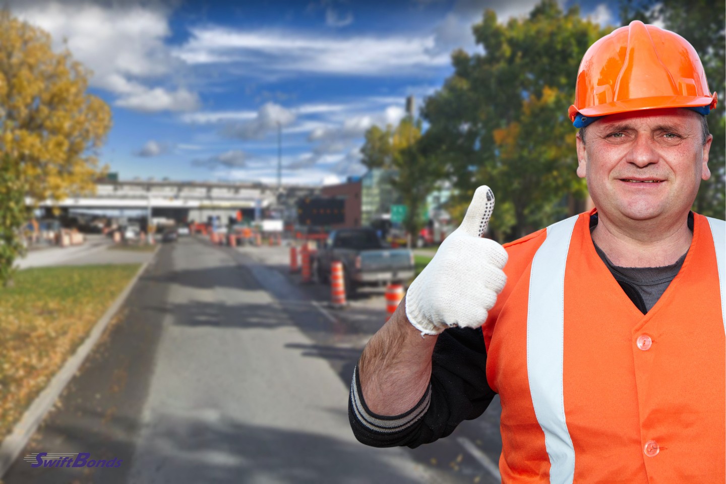 Road repair and a mature worker give it a thumbs up.