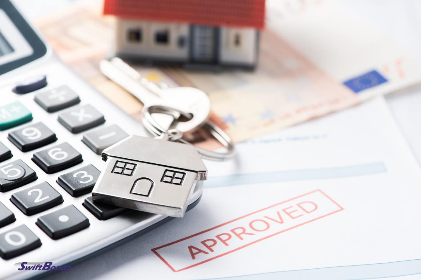 Home keys and a loan document that has been approved by the mortgage.
