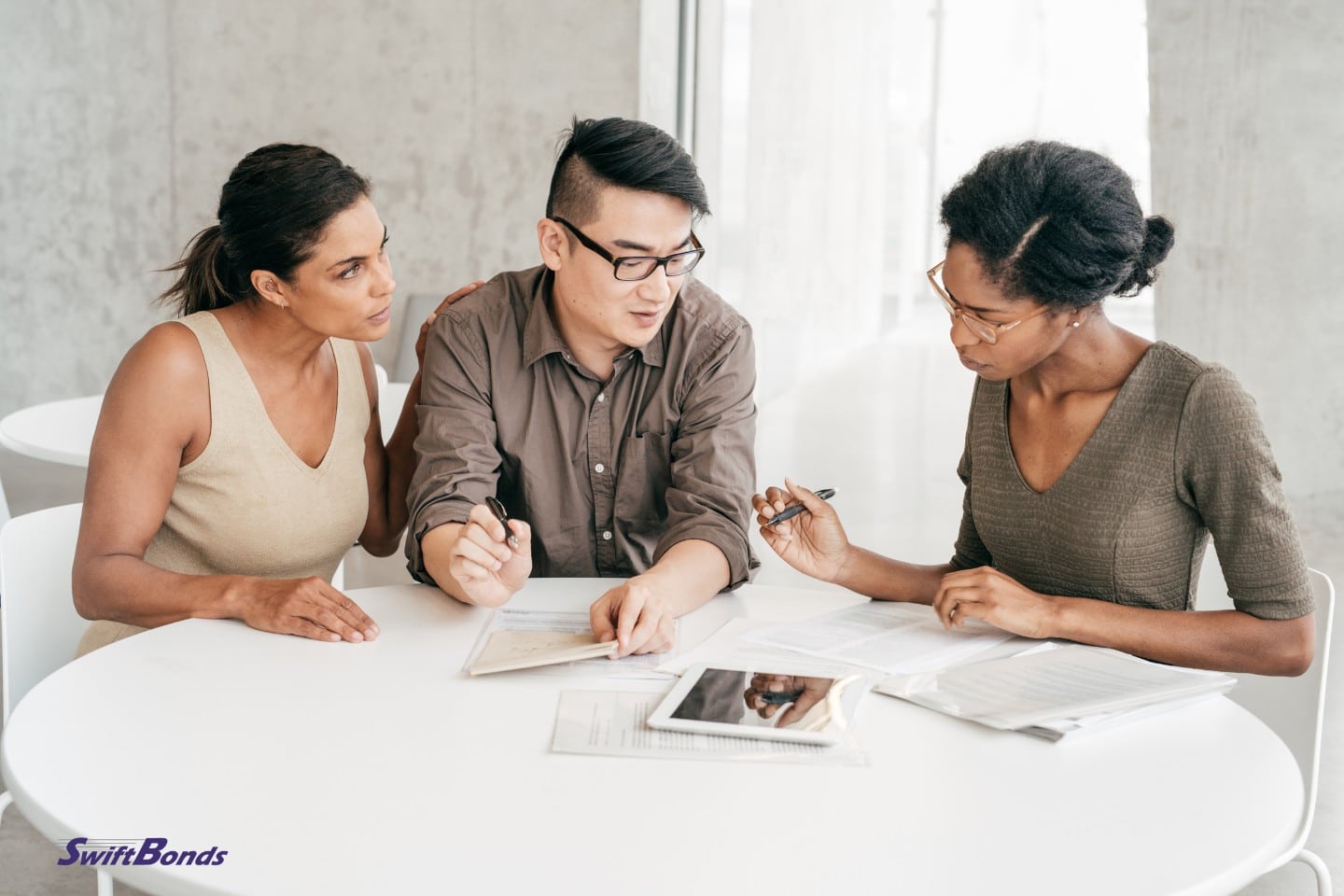 A couple meets with a mortgage broker.