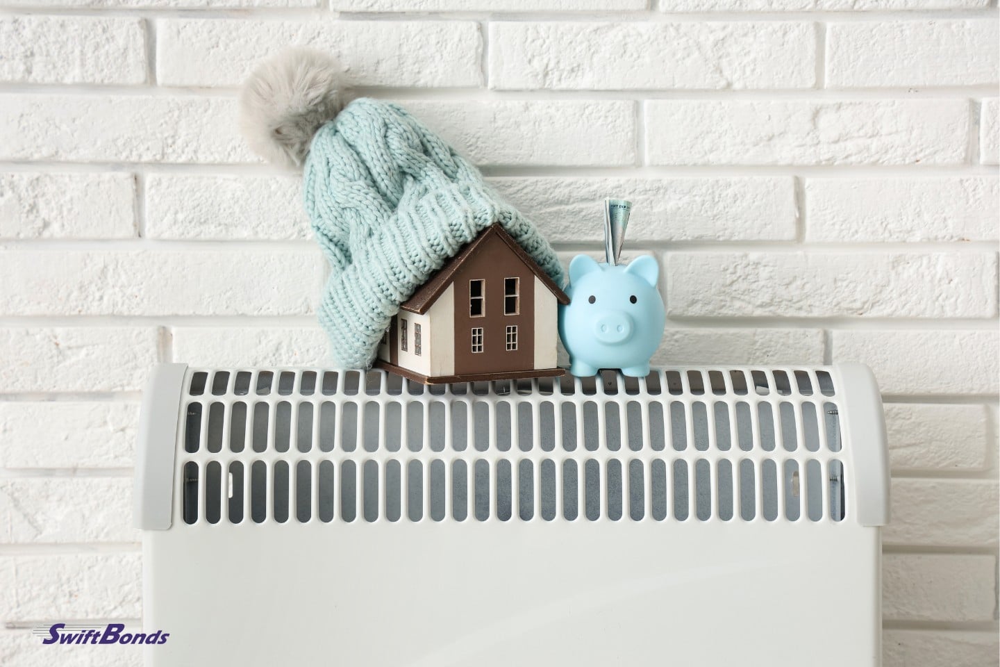 On the convertor heater next to the white brick wall is a python containing cash, a house model, and a warm cap.