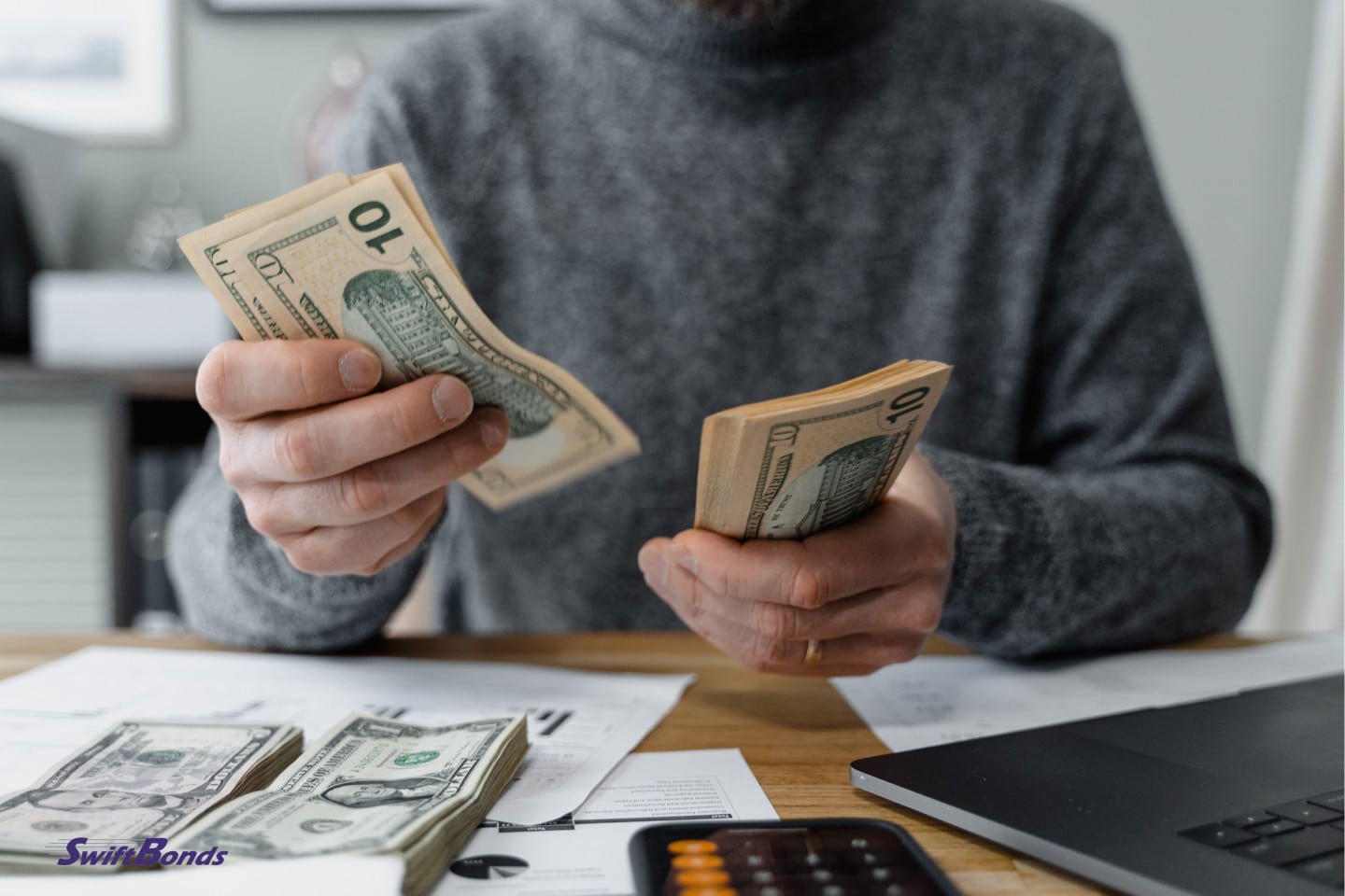 Someone counting money.