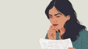 Professional woman carefully reviewing Oregon money transmitter bond application documents, representing financial licensees ensuring compliance with Oregon Department of Financial Regulation.