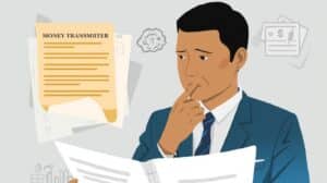 Illustration of a financial advisor explaining South Dakota money transmitter bond details to a client, with charts and bond documentation displayed on a screen in a professional office setting.